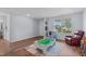 Comfortable living space featuring hardwood floors, a play area, and a cozy seating arrangement with natural light at 124 Lahinch Dr, Fuquay Varina, NC 27526