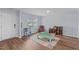 Versatile living area with hardwood floors, natural light, and ample space for seating and play at 124 Lahinch Dr, Fuquay Varina, NC 27526