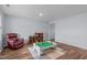 Inviting living room with hardwood floors, a comfortable recliner, and a well-organized play area for children at 124 Lahinch Dr, Fuquay Varina, NC 27526