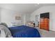 Bright bedroom with a cozy sitting area, television, and vaulted ceilings at 124 Lahinch Dr, Fuquay Varina, NC 27526