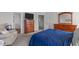 View of the main bedroom featuring walk-in closet, ensuite bath, plush carpet, and relaxing color palette at 124 Lahinch Dr, Fuquay Varina, NC 27526