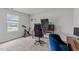 Inviting office space with natural light, multiple monitors, and an exercise bike at 124 Lahinch Dr, Fuquay Varina, NC 27526