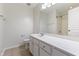 Bright bathroom with tile floors, white vanity, and toilet at 127 Cedar Elm Rd, Durham, NC 27713