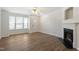 Open living room showcasing a fireplace, bright natural light, and sleek flooring for modern comfort at 127 Cedar Elm Rd, Durham, NC 27713