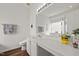 Bathroom featuring a large mirror, vanity with countertop, and a soaking tub at 1308 Snyder St, Durham, NC 27713
