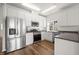 Modern kitchen with stainless steel appliances, white cabinets, and stylish countertops at 1308 Snyder St, Durham, NC 27713