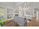 Open-concept living room with hardwood floors, fireplace, and view of the staircase and loft area at 1308 Snyder St, Durham, NC 27713