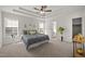 Serene bedroom with tray ceilings, neutral colors, and an ensuite bathroom at 1308 Snyder St, Durham, NC 27713
