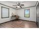 Bright bedroom featuring neutral walls, wood-look floors, and vintage-style furniture creating a cozy workspace at 1308 Tyson Loop Rd, Spring Hope, NC 27882