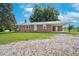 Charming brick home featuring a spacious yard and convenient carport at 1308 Tyson Loop Rd, Spring Hope, NC 27882