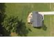 This aerial view shows the home's roof, deck, driveway, and wooded backyard at 139 His Way, Middlesex, NC 27557