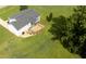 Aerial view of a home showcasing a wooden deck, screened porch, and expansive green lawn at 139 His Way, Middlesex, NC 27557