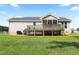 From the backyard, this home features a wooden deck, a screened porch, and vinyl siding at 139 His Way, Middlesex, NC 27557