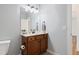 A bathroom with a single sink vanity, decorative touches, and a toilet can be seen in this image at 139 His Way, Middlesex, NC 27557