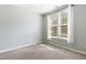 This is a well-lit bedroom that features a pair of double hung windows and neutral decor at 139 His Way, Middlesex, NC 27557