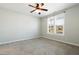 Bedroom with a ceiling fan, carpeted floors, and window overlooking the street at 139 His Way, Middlesex, NC 27557
