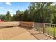 This spacious wooden deck has built-in seating, wooden railings, and lots of space to relax at 139 His Way, Middlesex, NC 27557