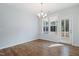 Charming dining area featuring wood floors, a modern chandelier, and a backyard view at 139 His Way, Middlesex, NC 27557