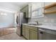 Kitchen with stainless steel appliances, marble countertops and olive-green cabinetry at 139 His Way, Middlesex, NC 27557