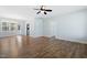 Open-concept living area with wood floors and neutral tones, connecting to the kitchen at 139 His Way, Middlesex, NC 27557