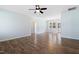 Spacious living room featuring modern floors, light walls, and a sleek ceiling fan at 139 His Way, Middlesex, NC 27557