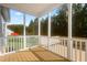 Cozy screened-in porch with wood flooring, perfect for enjoying the outdoors at 139 His Way, Middlesex, NC 27557
