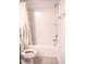 Bathroom featuring a shower and a toilet with a flower patterned curtain at 1402 Southpoint Trl, Durham, NC 27713