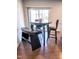Dining area featuring a round table, bench, chair, and hardwood floor at 1402 Southpoint Trl, Durham, NC 27713