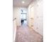 Upstairs hallway featuring carpet floors, leading to the bedroom and the bathroom at 1402 Southpoint Trl, Durham, NC 27713