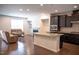 Open-concept kitchen featuring stainless steel appliances and an island, perfect for entertaining at 1402 Southpoint Trl, Durham, NC 27713
