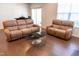 Cozy living area showcasing plush sofas, a contemporary coffee table, and a bright, airy atmosphere at 1402 Southpoint Trl, Durham, NC 27713
