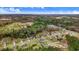 An aerial view showcases the neighborhood's layout, lush greenery, and convenient access to amenities at 147 Everwood Dr, Four Oaks, NC 27524