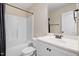 Well-lit bathroom includes a vanity with storage and a shower-tub combination at 147 Everwood Dr, Four Oaks, NC 27524