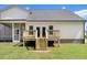 Back exterior featuring a wooden deck and screened-in porch at 147 Everwood Dr, Four Oaks, NC 27524