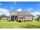 Back exterior showcasing deck and screened-in porch at 147 Everwood Dr, Four Oaks, NC 27524
