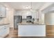 Modern kitchen featuring stainless steel appliances, granite countertops, island sink, and ample cabinet space at 147 Everwood Dr, Four Oaks, NC 27524