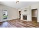 Cozy living room with hardwood floors and a fireplace at 147 Everwood Dr, Four Oaks, NC 27524