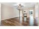 Spacious living room showcasing a fireplace, modern hardwood floors, and neutral paint at 147 Everwood Dr, Four Oaks, NC 27524