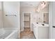 Main bathroom features a walk-in closet, dual vanity with framed mirrors, and a separate shower and tub at 147 Everwood Dr, Four Oaks, NC 27524