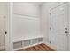 Functional mudroom with built-in bench seating and storage cubbies near the door at 147 Everwood Dr, Four Oaks, NC 27524
