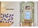 Attic bonus space with a desk and chairs with light green wood paneling on walls and ceiling at 1516 Edgevale Rd, Durham, NC 27701