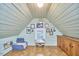Bonus room with a daybed, desk and chair, wooden floors, and light green wood paneling at 1516 Edgevale Rd, Durham, NC 27701