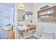 Charming bathroom with mosaic tile floor, vanity, and decor at 1516 Edgevale Rd, Durham, NC 27701
