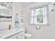 Bright bathroom showcasing a modern vanity, gold faucet, and white subway tile at 1516 Edgevale Rd, Durham, NC 27701