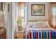 Bright bedroom featuring a wood-framed bed and colorful accents at 1516 Edgevale Rd, Durham, NC 27701