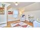 Bright bedroom featuring hardwood floors, a cozy reading nook, and cheerful decor at 1516 Edgevale Rd, Durham, NC 27701