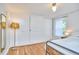 Bedroom with wide closet, wood floors and a single bed at 1516 Edgevale Rd, Durham, NC 27701