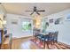 Well-lit dining room featuring hardwood floors and large windows at 1516 Edgevale Rd, Durham, NC 27701