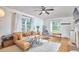 Bright living room with hardwood floors, modern furniture, and ample natural light at 1516 Edgevale Rd, Durham, NC 27701