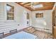 Cozy outdoor patio area featuring brick flooring, wood ceilings, and plenty of natural light at 1516 Edgevale Rd, Durham, NC 27701